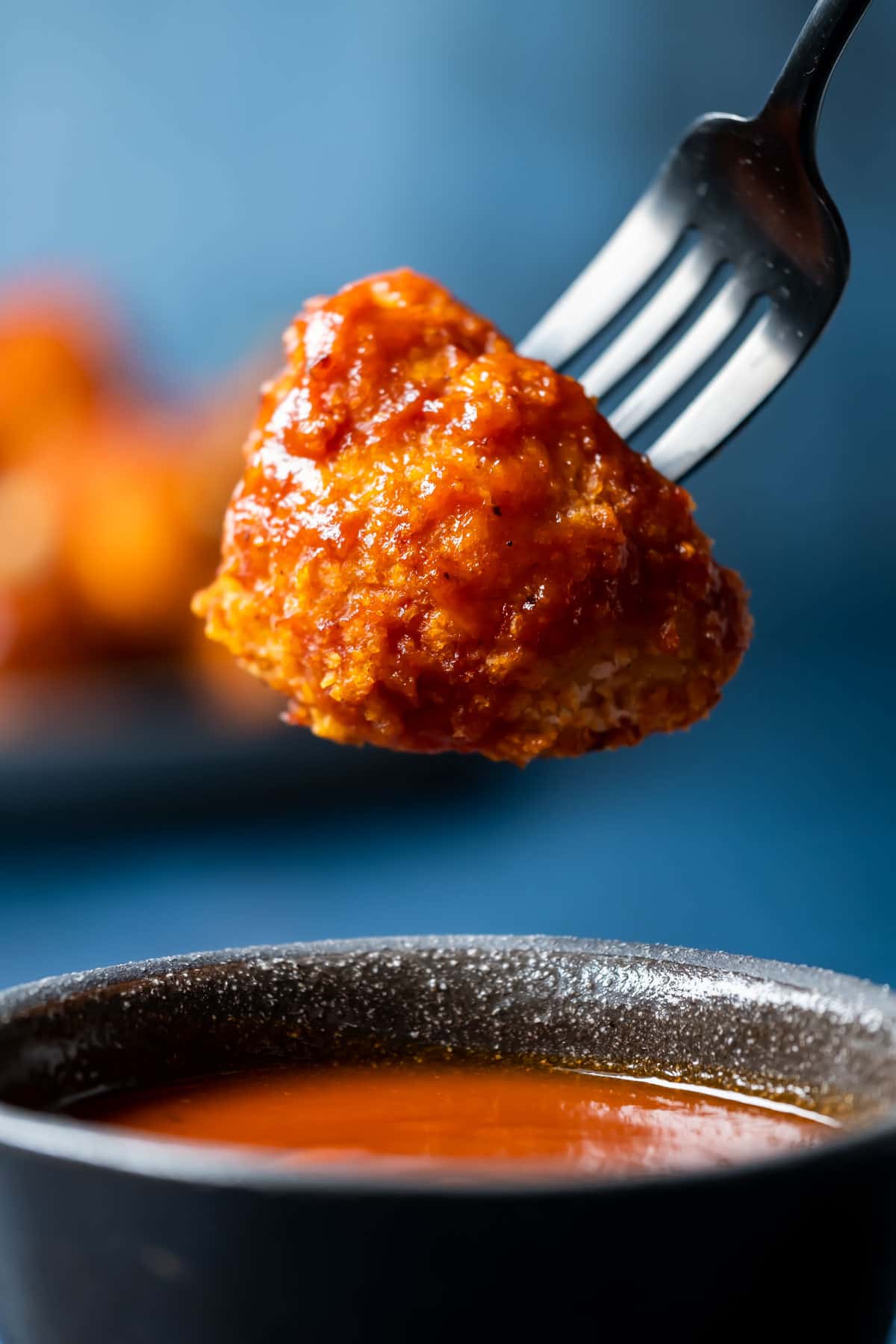 BBQ cauliflower wing on a fork.